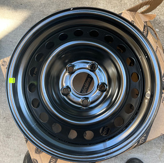 Mopar 17"x7.5" Steel Wheel sitting on the ground