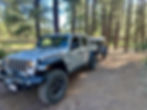 Jeep Gladiator Rubicon Ecodiesel and Exventure XV-3 Off-Road Trailer With Roof Top Tent installed on trailer. Location is a campground in Flagstaff Arizona