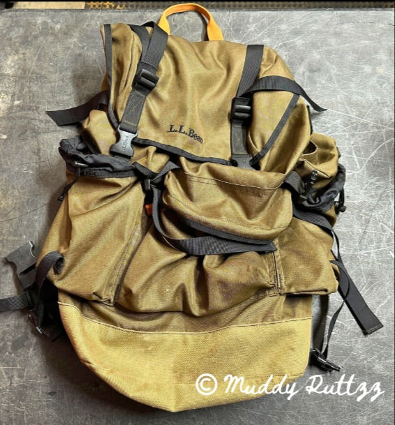 Green Back Pack sitting on table