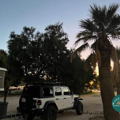 Jeep Wrangler Ecodiesel and Exventure XV-3 off-road trailer parked at rest stop off Highway 10 in Palm Springs Rest stop with Roof Top Tent deployed.