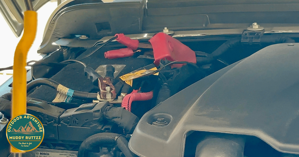 Under the hood of the Jeep Gladiator Ecodiesel. The Viair's electrical leads use simple alligator clips to attach to the vehicles battery and power up the off road tires.