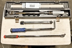 Torque wrenches lined up on table organized for DIY Jeep Mopar Bilstein install.