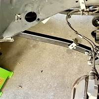 Wheel, shock, coil spring removed to be replaced by DIY Jeep Lift Kit Install.