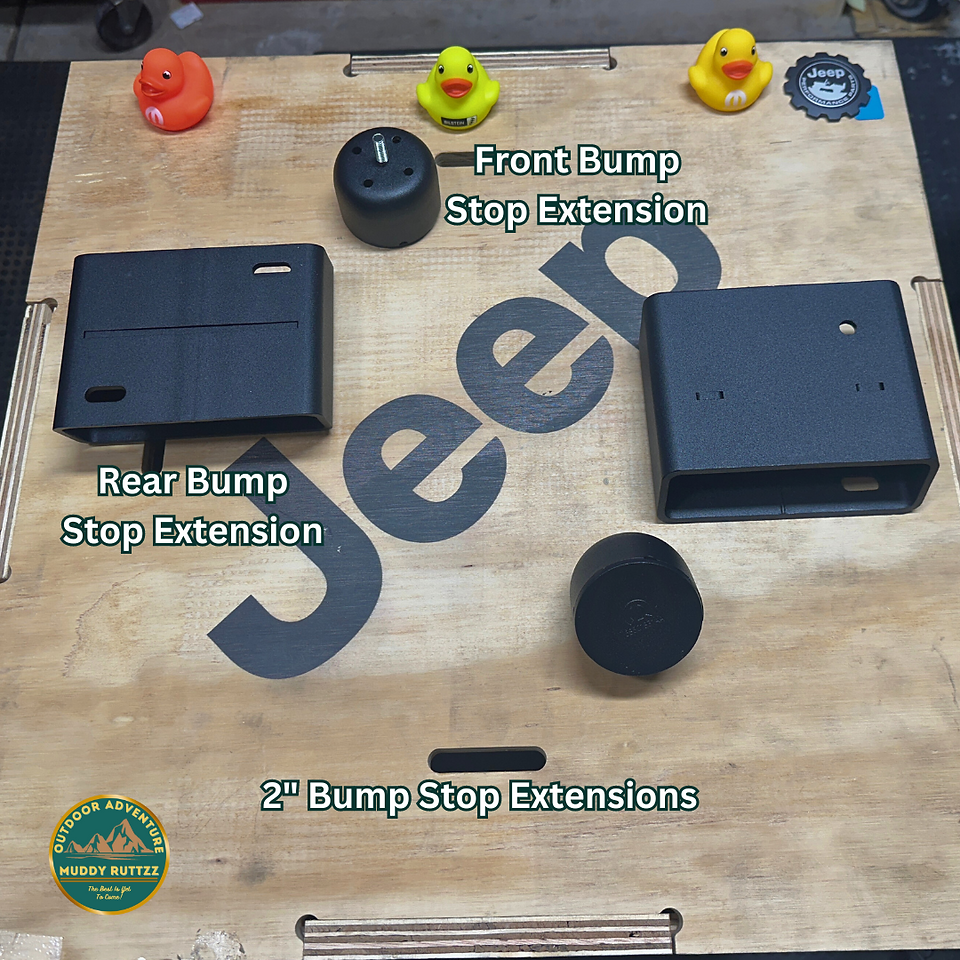 Bump Stop Extensions included with the Mopar Jeep Bilstein Lift kit laid out on cover to parts crate. 