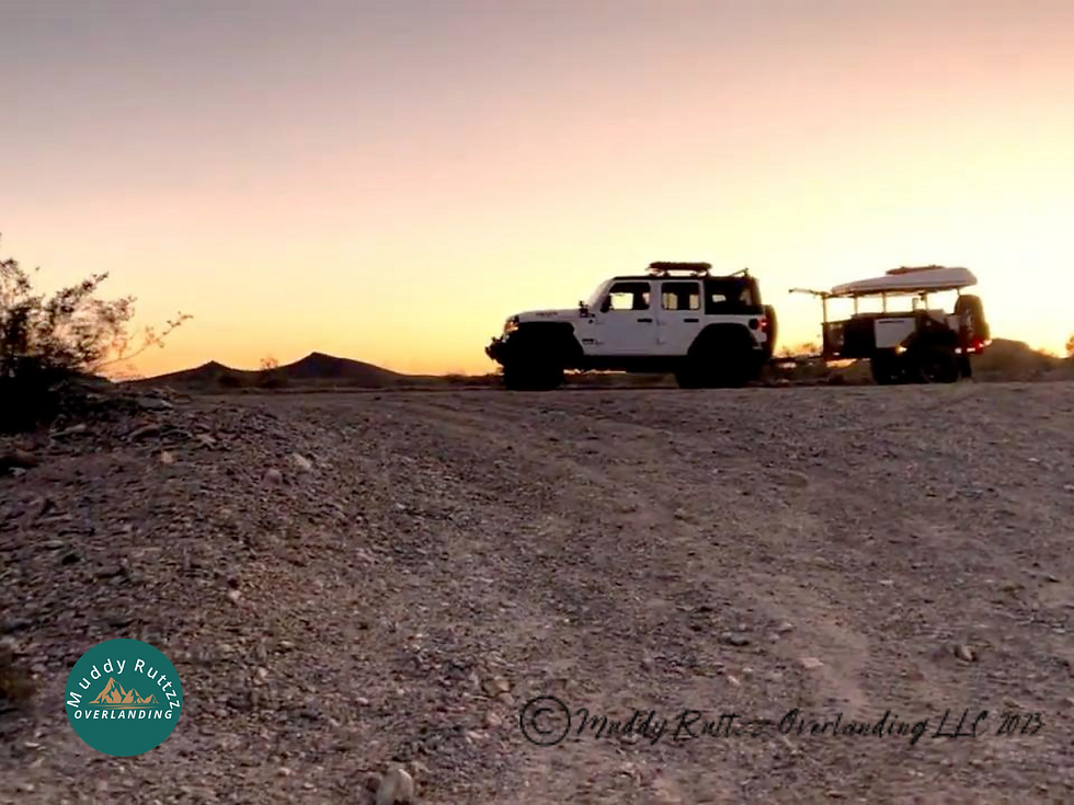 Jeep Wrangler Willys Ecodiesel and Exventure XV-3 On The Bradshaw Trail with the sun setting making the sky glow behind.