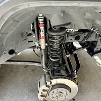 Stock Fox shock and coil spring need to be removed for install of Mopar Bilstein lift kit, DIY Jeep Lift Kit Install.