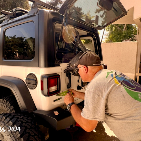 A step in installing the tailgate reinforcement is drawing Lines For Checking Alignment after bolts are re-installed in tailgate to assure proper operation of the tailgate after the install.