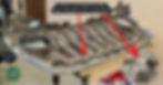 Car grille on a workbench with red arrows pointing to panel retaining clips. Text reads: "8 of these clips fasten the grille to the crossmember."
