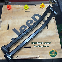 New control arms included in Mopar Jeep Lift Kit for DIY install, text and muddy ruttzz logo visible.