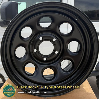 997 Type 8 Steel Wheel sitting on top of box Muddy Ruttzz logo visible.
