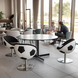 A room with people at a table and three swivel chairs by hattrick in a soccer design made of black and white Genuine leather, manufacturer lillus