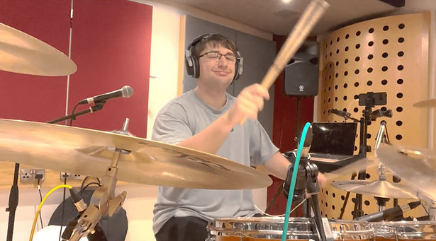 Sam Tempest recording the drums in a studio