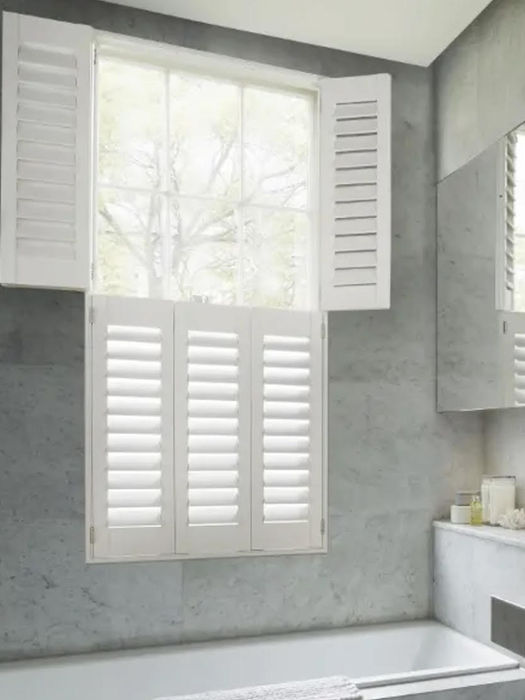 White shutters closed on the bottom half and open on top half white in colour