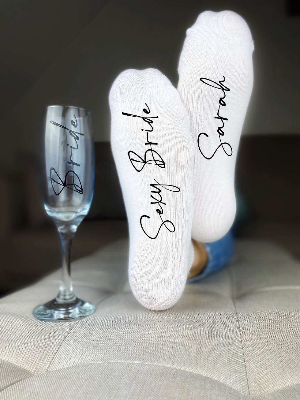Thumbnail: White cotton trainer/ankle socks for ladies with black text on one sock Sexy Bride and Sarah on the other sock.