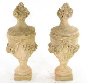 Pair of cast stone urns