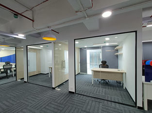 The office area designed with wood and glass finish