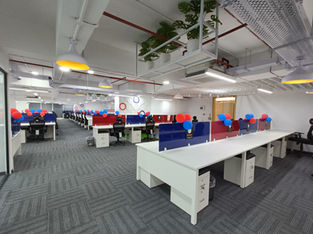 The office area designed with wood and glass finish