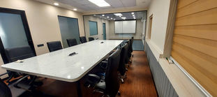 The office area designed with wood and glass finish