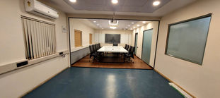 The office area designed with wood and glass finish
