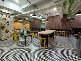 The office area designed with wood and glass finish
