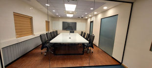 The office area designed with wood and glass finish