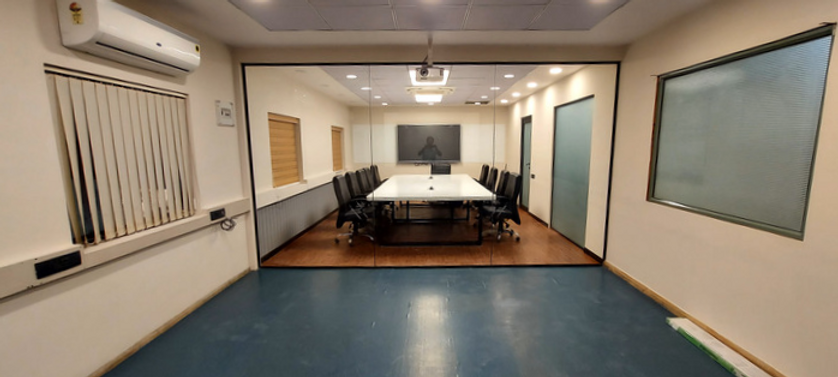 The office area designed with wood and glass finish