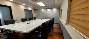 The office area designed with wood and glass finish
