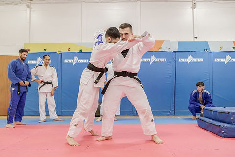 2 judo students grappling