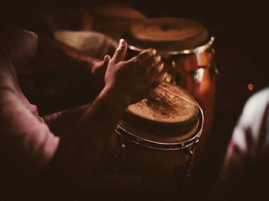 A Person Playing a Drumset