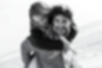 Playful couple enjoying an intimate moment, woman piggybacking on her partner
