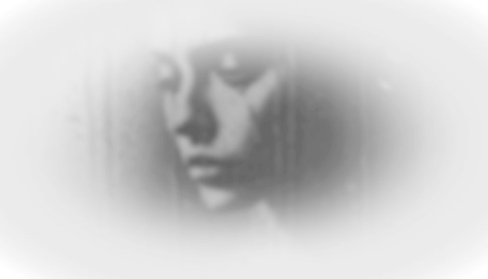 Faded image of a person with tears, symbolizing emotional trauma