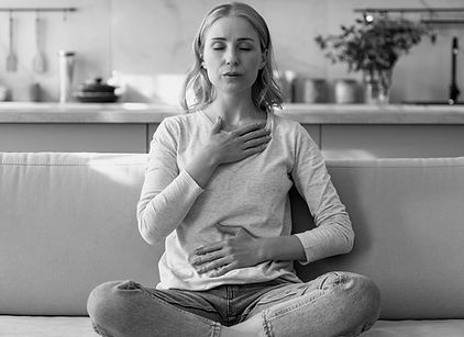 Woman breathy on couch