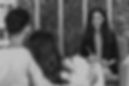 Couple engaged in a therapy session, working with a professional to improve communication and connection.