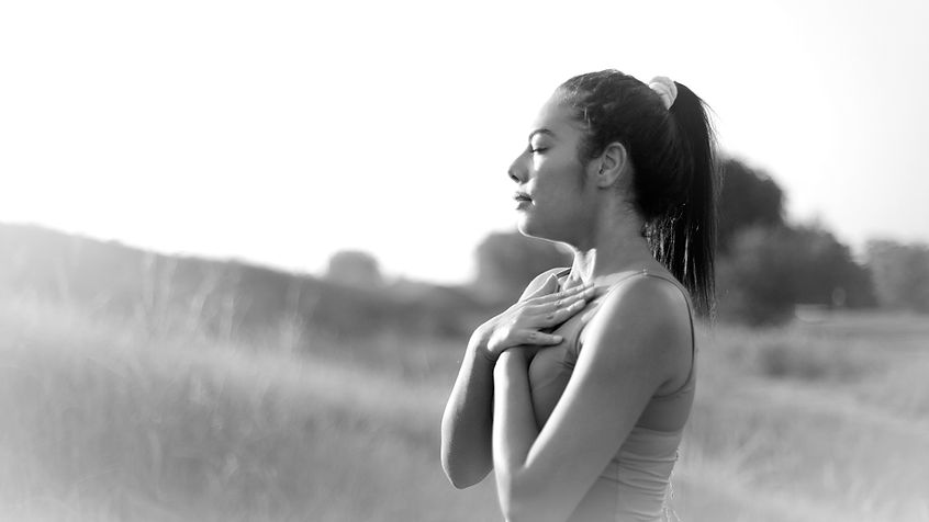 A woman breathing outside