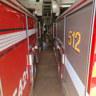 side by side fire engines in repair bay