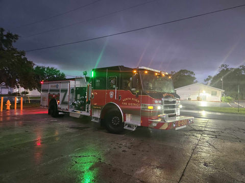fire engine with lights on at night