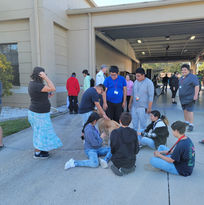 students play with the fire therapy dog