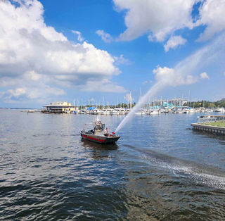 fireboat spraying water in bay