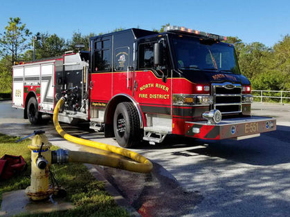 Fire engine connected to a hydrant