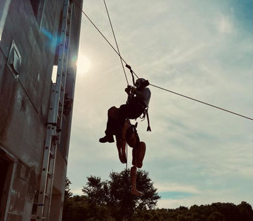 firefighter repelling during rope ops training