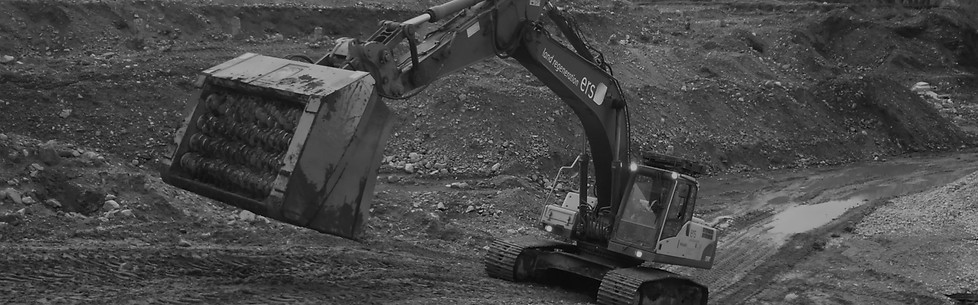 Black and White photo of a digger with a REMU screening bucket