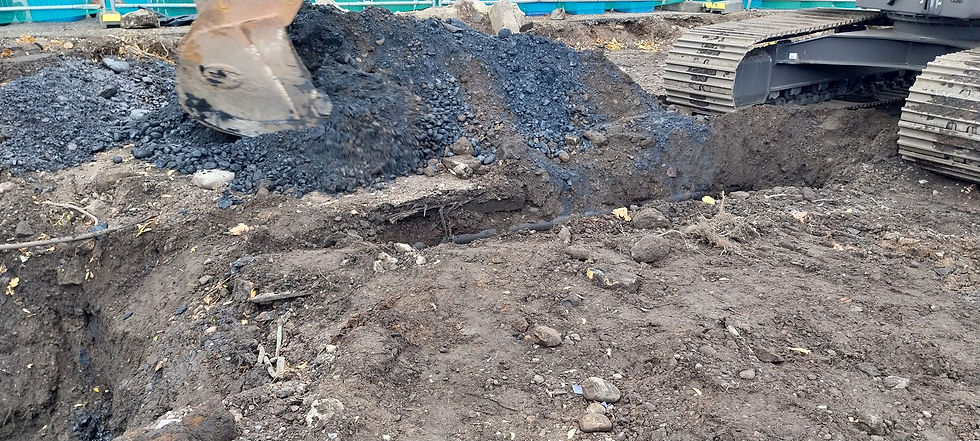 Some of the heavily coal tar impacted material (black)