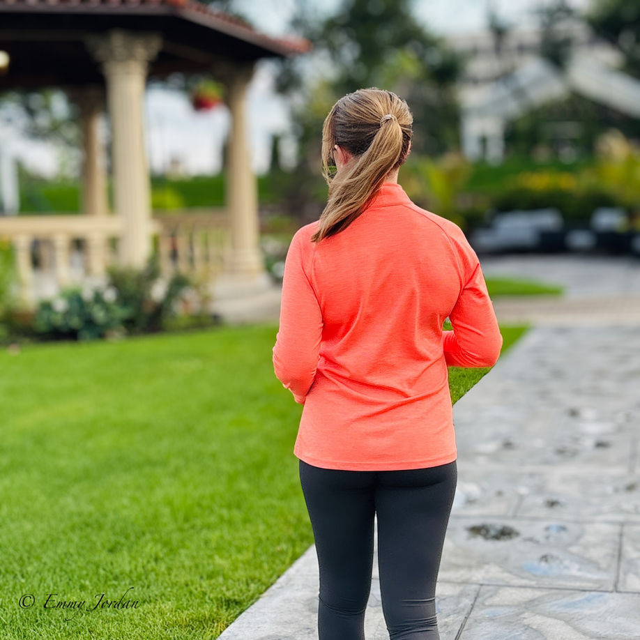Orange workout shirt and yoga pants outside