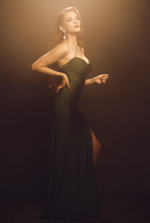 Woman in elegant green gown, fashion portrait