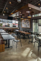 Spacious Pieology Pizzeria dining area with tables and chairs