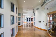 Clean, bright hallway with "Pride" sign