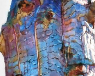 Close up of remnant burnt tree trunks art piece showing charred remains.