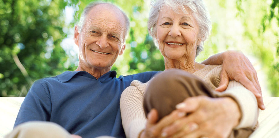 Two older people sitting