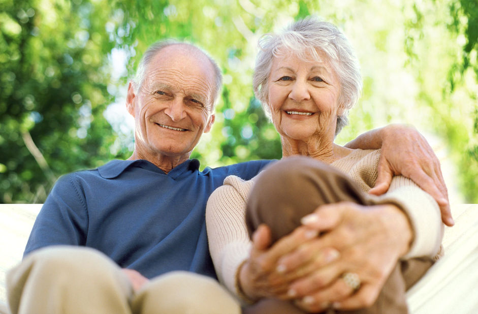 Two older people sitting