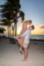 Surprise proposal in Key West as he picks up his bride to be on the beach at sunset
